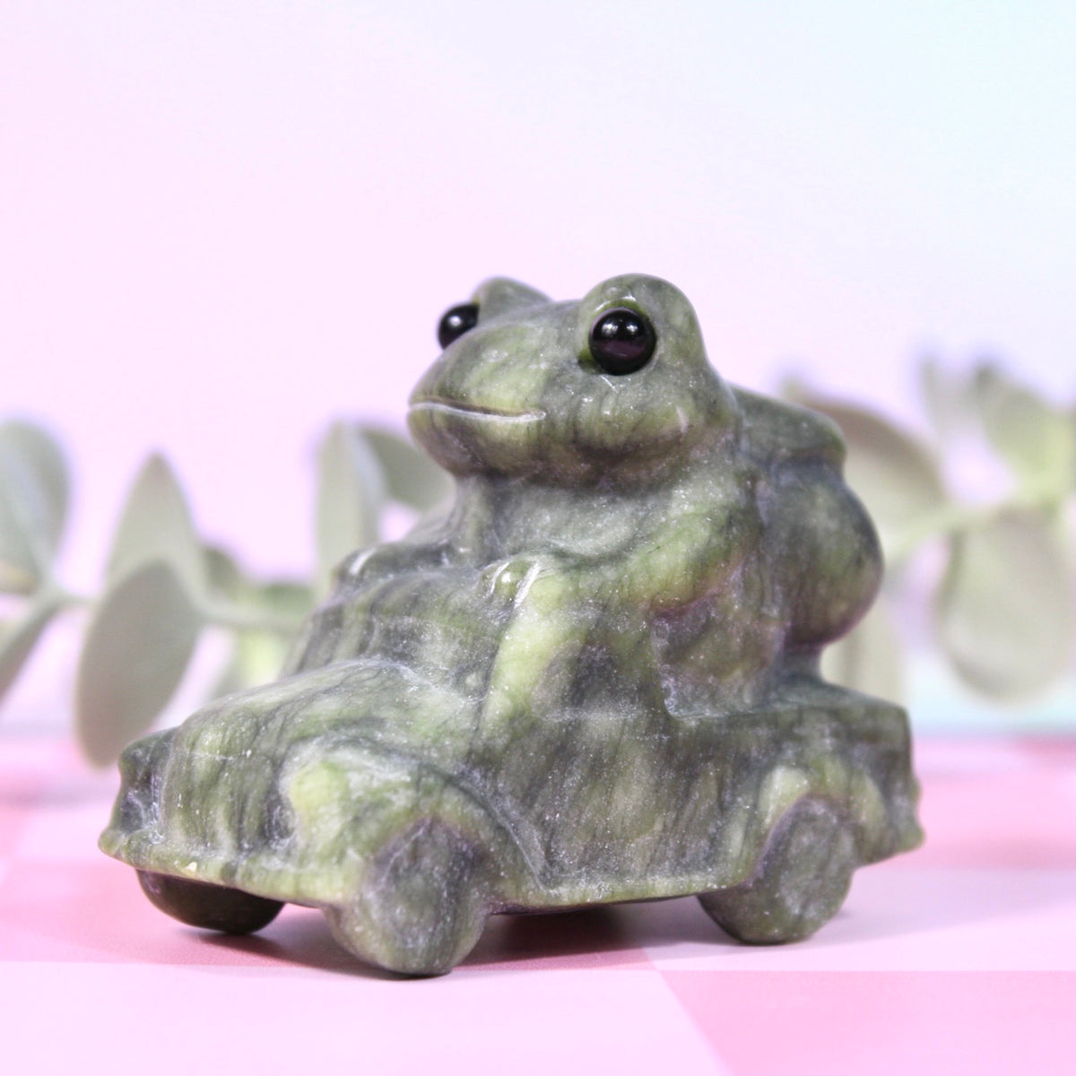 Green jade frog driving car