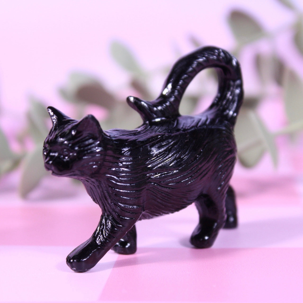 Black obsidian walking cat